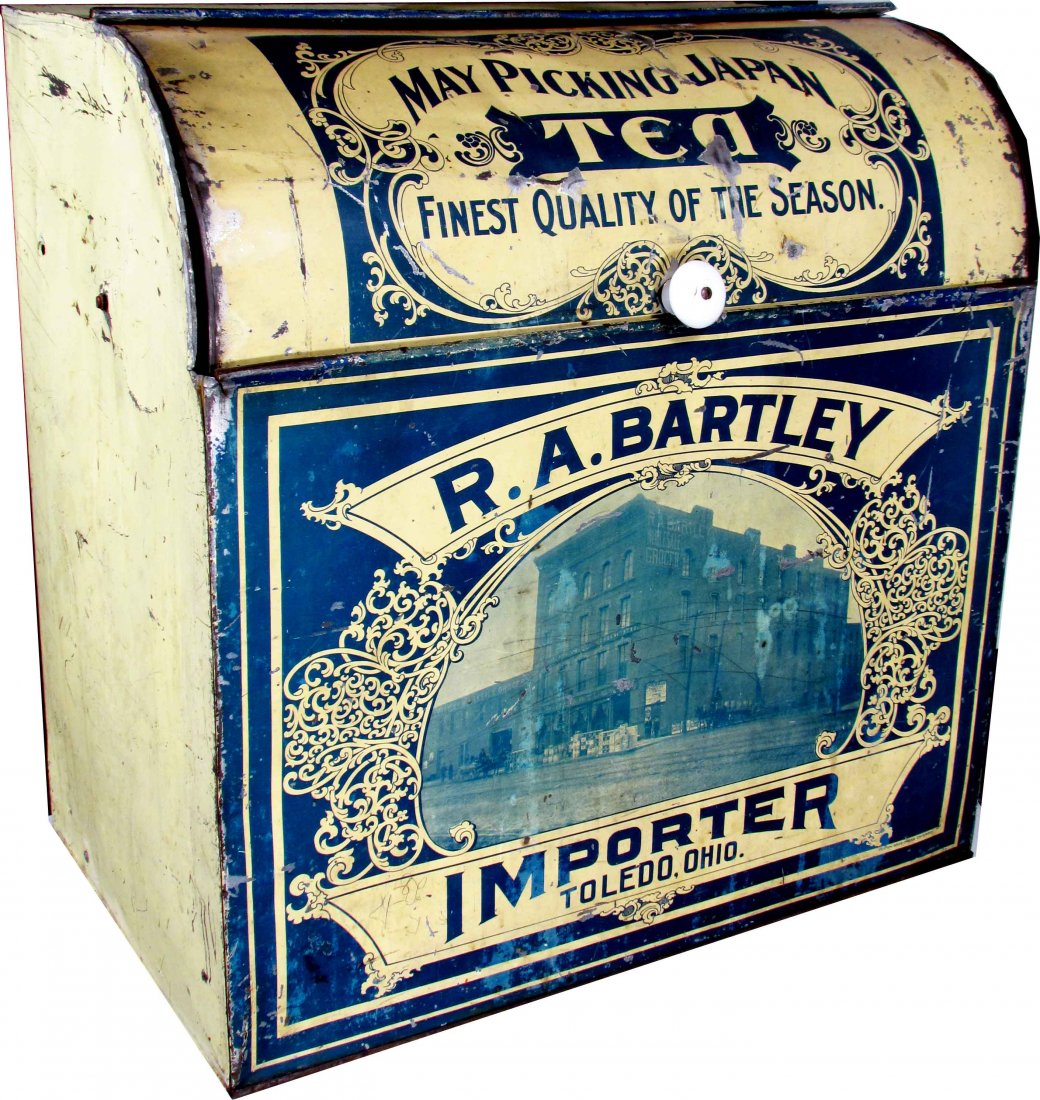R.A. Bartley May Picking Japan Tin Store Bin: R.A. Bartley May Picking Japan Tin Store Bin, Toledo, Ohio. Depicting R.A. Bartley Building on front. Scratches, dents and paint loss otherwise fair to good condition. 20 1/2 X 21 X 12 1/2 inches.
