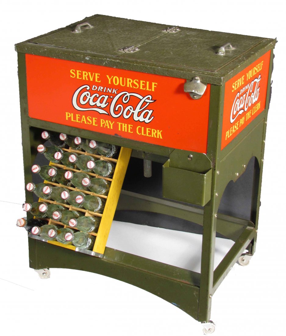 Coca-Cola Salesman Sample Cooler: Coca-Cola Salesman's Sample Glass Cock Cooler. Comes with original opener, cap catcher, and sample cases of bottles. Slight rubs and scratches on top otherwise excellent original condition. 10 1/2 X 1