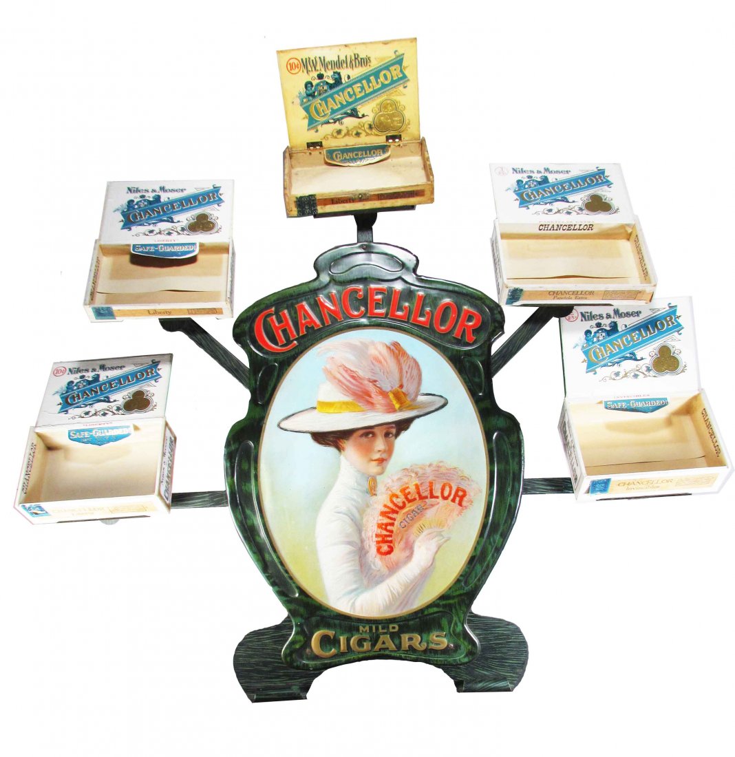 Chancellor Cigars Die Cut Tin Store Display: Chancellor Cigar Die Cut Embossed Tin Store Display. A few wrinkles at the top otherwise excellent condition. Comes with five Chancellor cigar boxes for display. 39 1/2 X 32 inches.