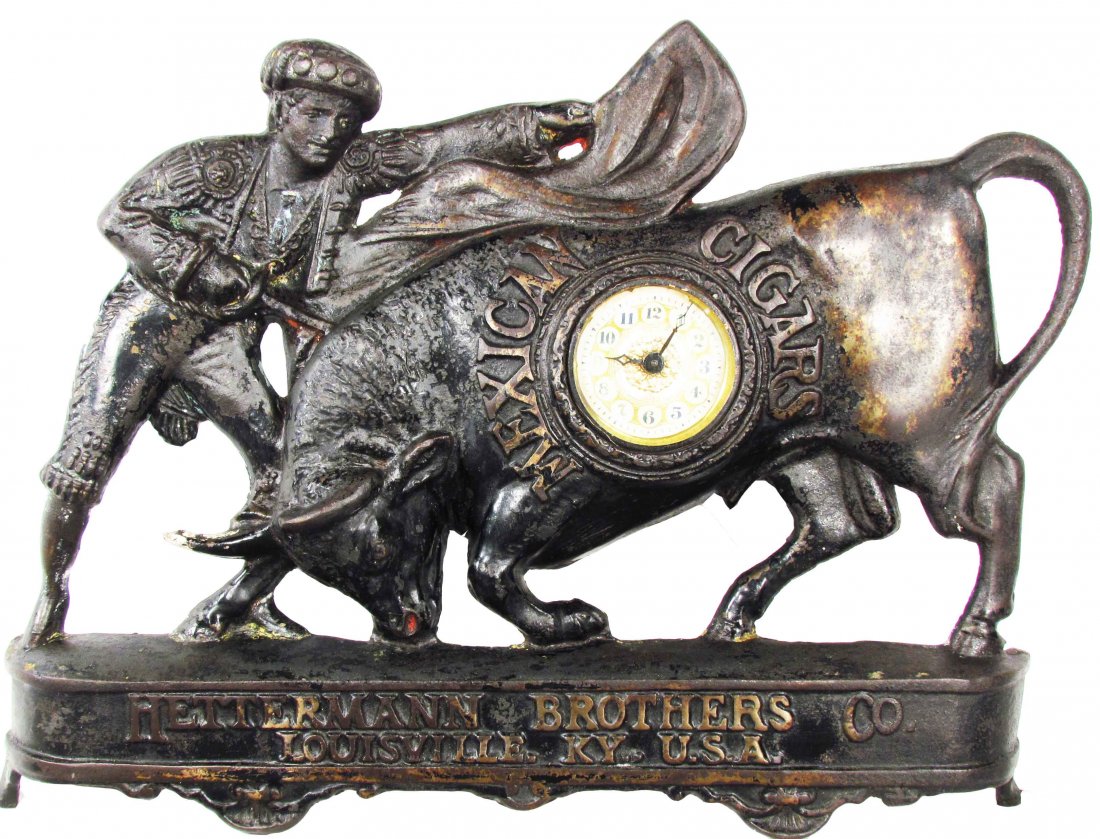 Cast Iron Advertising Clock for Mexican Cigars: Cast Iron Advertising Clock for Mexican Cigars. Hettermann Brothers Co. Louisville, KY USA. Some wear to paint otherwise very good condition. 18 X 13 X 2 inches.