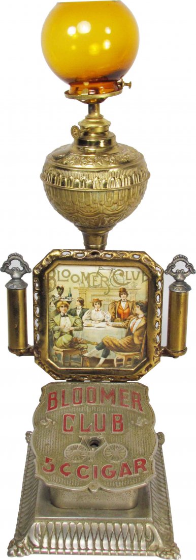 Bloomer Club Cigars Cigar Tip Cutter Lighter: Bloomer Club Cigars Cigar Tip Cutter and Lighter. Nickel and brass plated cast iron with brass plated frame and reservoir. Image depicting of women enjoying cigars. Overall excellent condition. 7 X 17