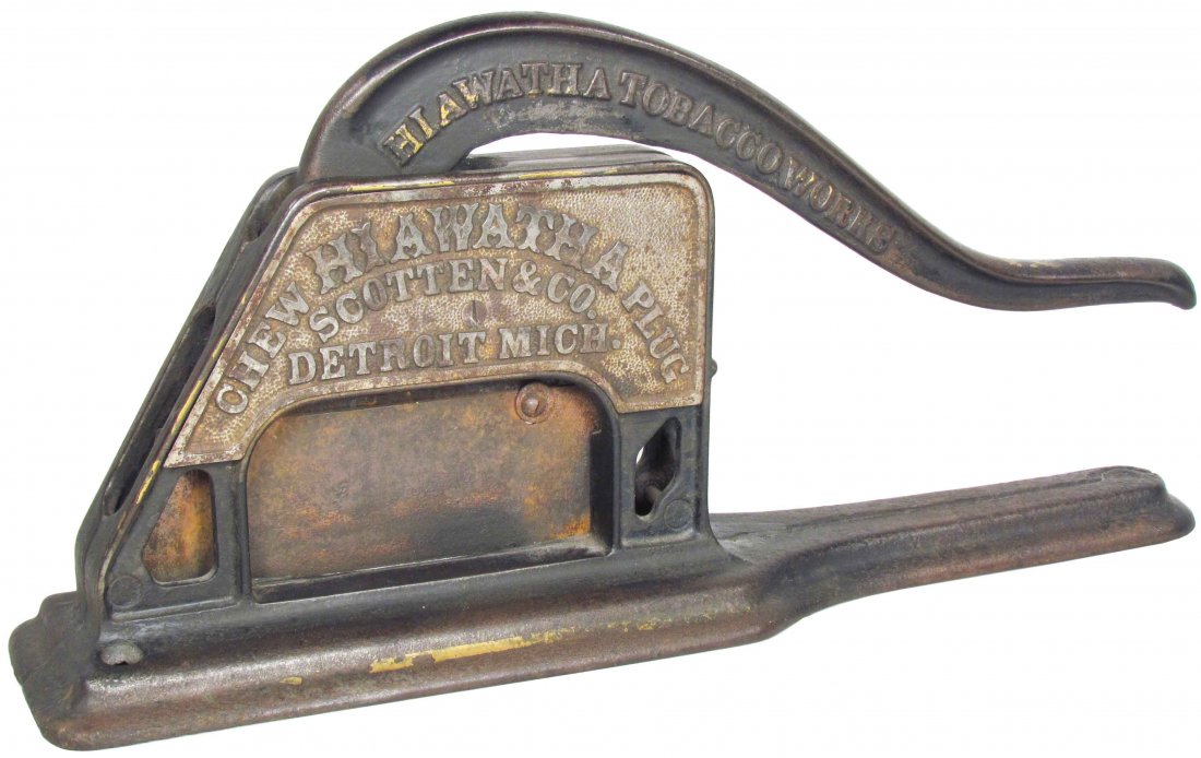 Hiawatha Cast Iron Tobacco Plug Cutter: Hiawatha Tobacco Works Cast Iron Tobacco Plug Cutter. Scotten & Co. Detroit, Mich. Patent 1883 Griswold mfg. Co. Erie, PA Rust on blade, otherwise overall good condition. 16 1/4 inches long.