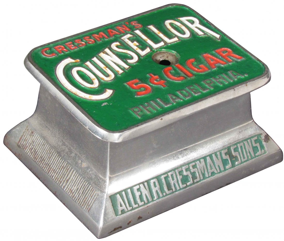 Creassman's Counsellor Cigar Tip Cutter: Creassman's Counsellor Cigar Tip Cutter. Brunhoff Mfg. Co. Cincinnati Maker. Minor staining to white letters otherwise very good original condition. 6 1/2 X 3 1/4 X 5 inches.