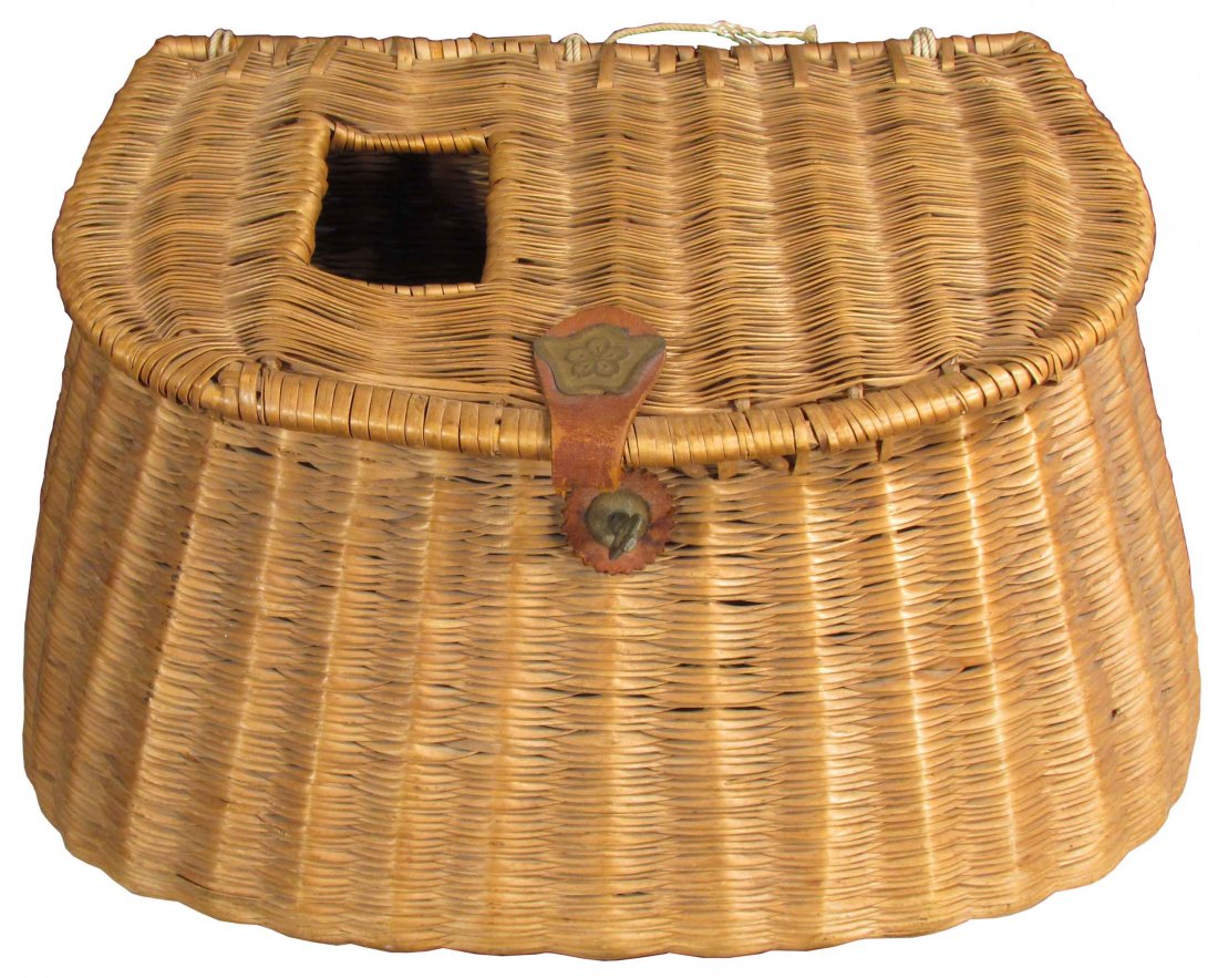 Fishing Creel: Fishing Creel. Broken leather front closure and some breakage to rattan edge in back otherwise overall good condition. Partial original paper label on bottom is illegible. 13 X 8 X 5 inches.