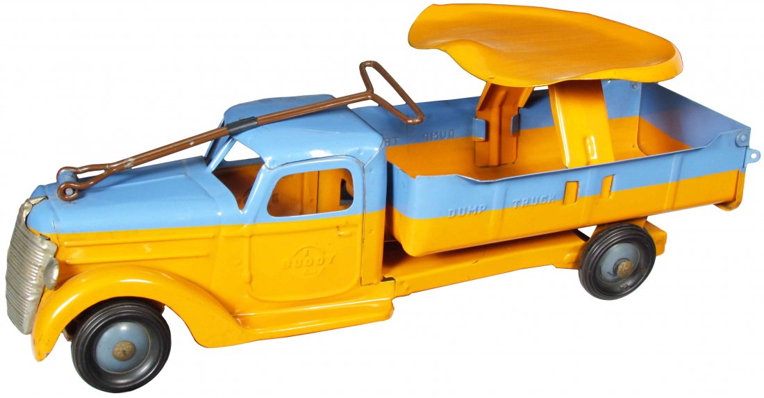 Buddy-L Pressed Steel Ride-On Dump Truck: Buddy-L Pressed Steel Ride-On Dump Truck. Some rust to passenger side fender and scratches on top cab otherwise very good condition. 21 inches long