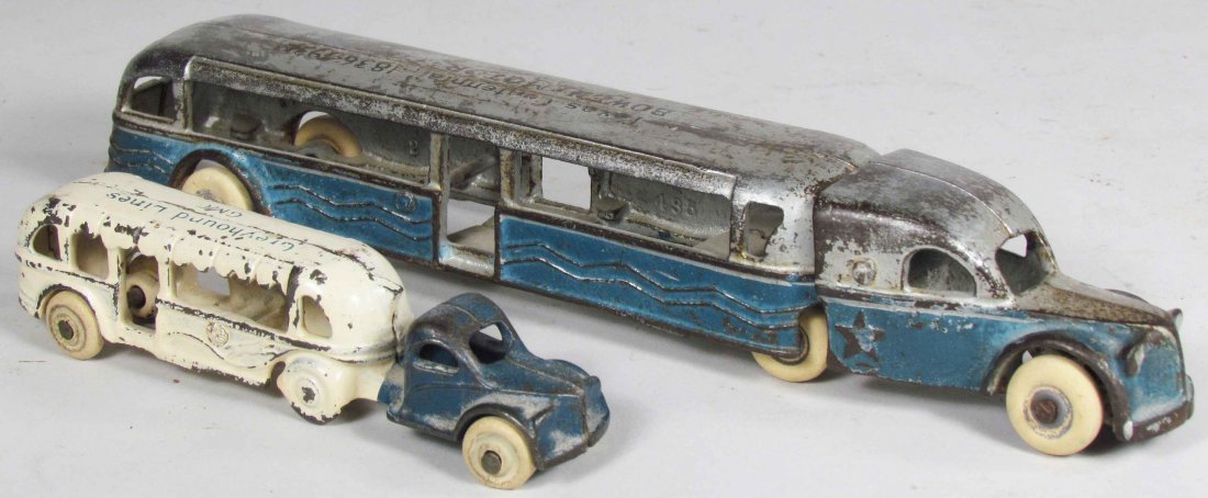 Two Promotional Cast Iron Toy Buses: Two Promotional Cast Iron Toy Buses. Texas Centennial Bowen Motor Coach and 1933 Greyhound Lines. Overall good condition. Largest measures 10 3/4 inches long.
