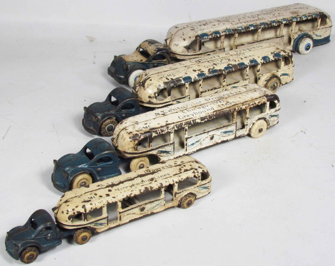 Four Promotional Cast Iron Toy Buses: Four Promotional Cast Iron Toy Buses. Chicago-1933, A Century of Progress. GMC Greyhound Lines. Overall good condition. 14 1/4 to 7 1/2 inches each.