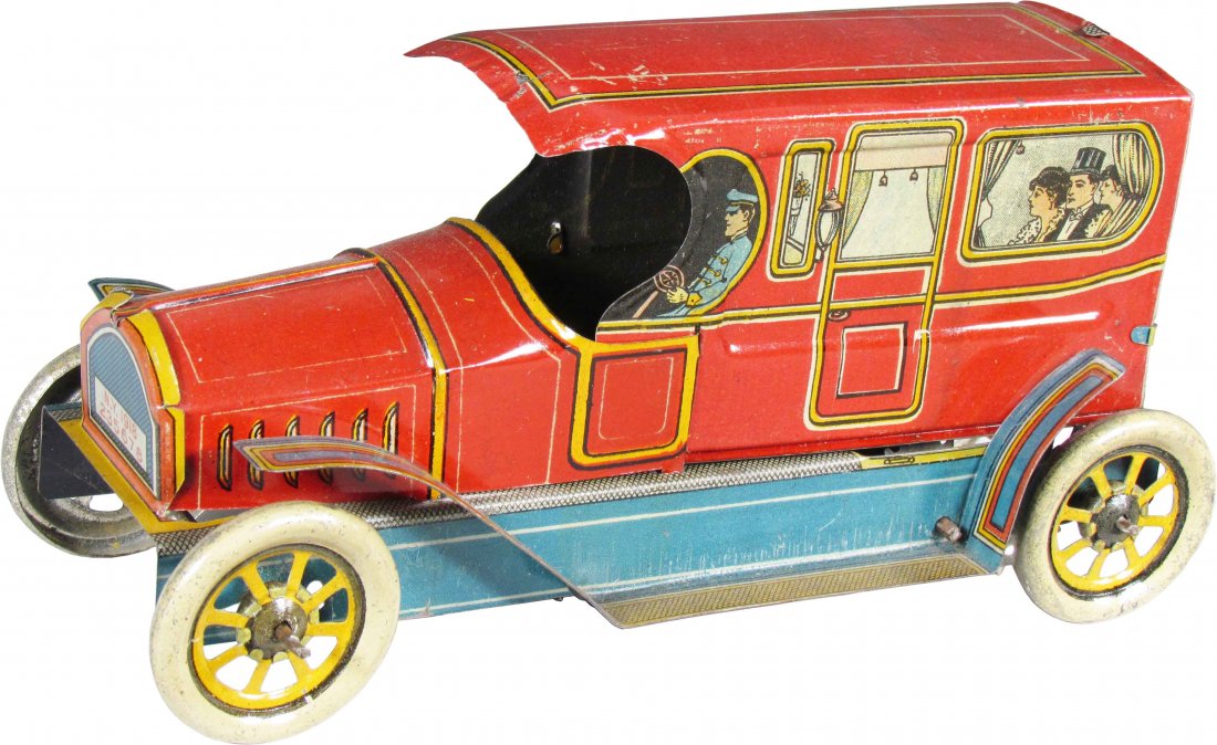 J. Chein Chauffeured Sedan Tin Litho Toy: J. Chein Chauffeured Sedan Tin Litho Wind Up Toy, ca. 1920. Scratches and rubs otherwise very good condition. 8 inches long.