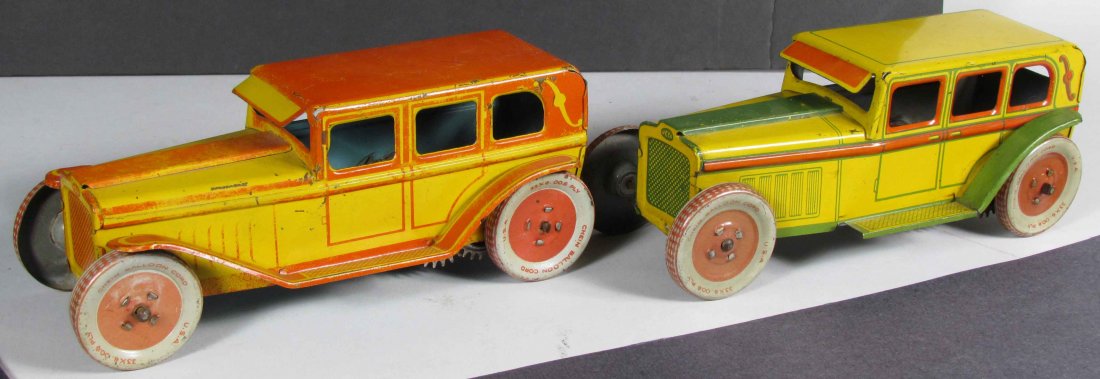 Two J. Chein Tin Litho Wind Up Toy Sedans: Two J. Chein Tin Litho Wind Up Toy Sedans. Red and green versions. Chein license plate reads NJ44 on both. Fading to red version otherwise very good condition. Both 8 1/2 inches long.