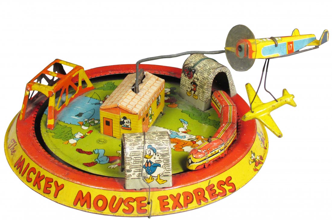 Louis Marx The Mickey Mouse Express Toy: Louis Marx The Mickey Mouse Express Tin Toy. Some fading and minor edge wear otherwise very good condition. 10 inch diameter.