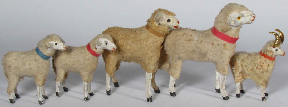 Five "Putz" Toy Sheep: Five "Putz" Toy Sheep. Various sizes and conditions. Tallest measures 3 1/2 inches long.