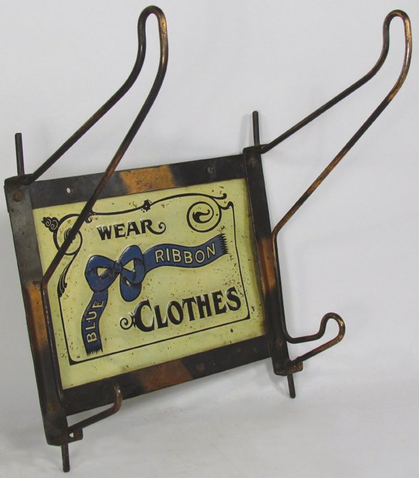 Wear Blue Ribbon Clothes Coat Rack: "Wear Blue Ribbon Clothes" Coat Rack. Copper flashed hooks and frame with embossed tin advertising center. Flecks of paint loss otherwise good condition. 9 1/2 X 11 X 7 inches.