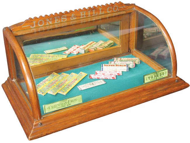 Jones & Hill Co. Oak Gum Display Case: Jones & Hill Co. Oak Gum Display Case. Curved glass front with original stencil on marquis and Jones Gum decals on front. Comes with several gum packs including (4) Oh Boy, Beeman, Hickman's Silver Bi
