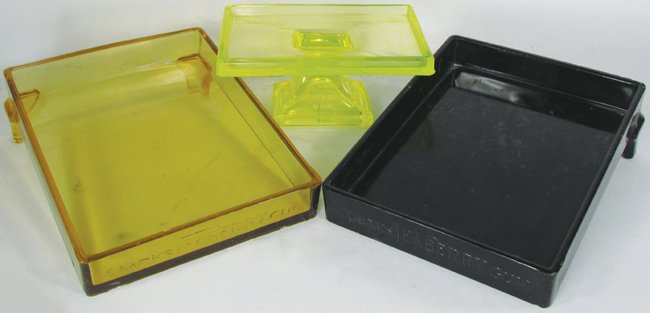 Three Clarks Teaberry Glass Gum Display Trays: Three Clarks Teaberry Embossed Glass Gum Store Display Trays. Black, amber and Vaseline glass. Few chips on amber and black trays otherwise overall good condition. Black tray measures 7 X 3 X 8 1/4 in