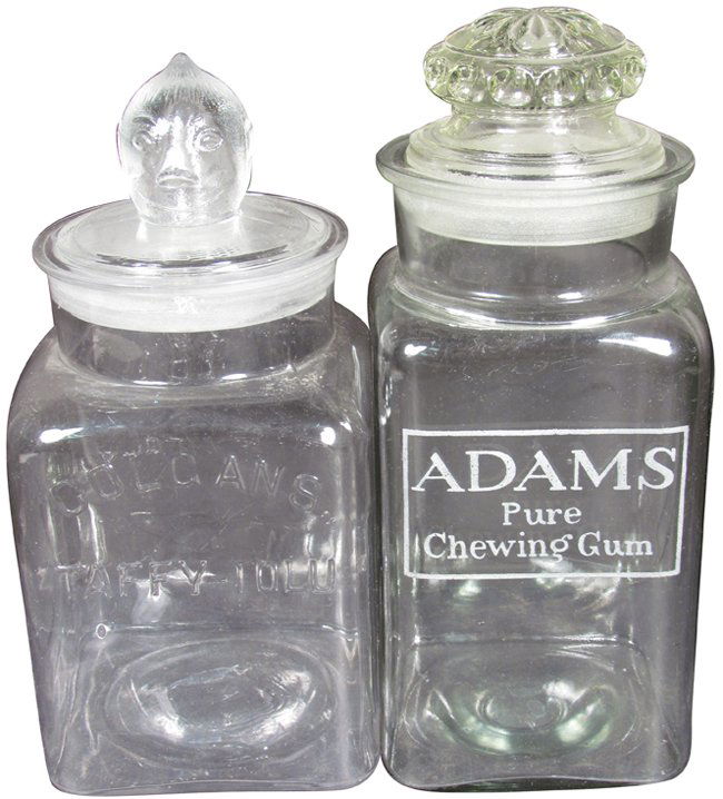 Two Gum Jars. Embossed Colgans Taffy-Tolu Jar: Two Gum Jars. Embossed Colgans Taffy-Tolu Jar, chips on lid. Adams Pure Chewing Gum with ground glass lid. Tallest measures 12 inches tall.