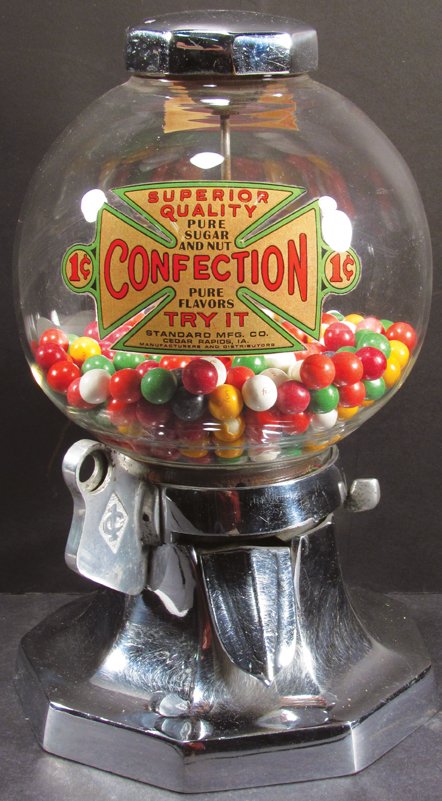 Standard Mfg. Co. Sugar & Nut Co. Gumball Mach.: Standard Mfg. Co. Sugar & Nut Co. One Cent Gumball Machine. Aluminum. Excellent working condition. 13 inches tall.
