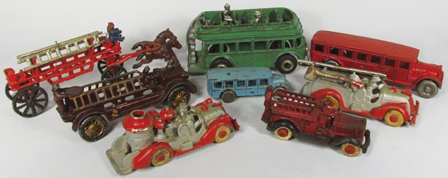 Eight Cast Iron Toys: Eight Cast Iron Toys. Arcade Double Decker bus. Arcade "Fageot" red bus. Small blue bus. (5) Fire toys including horse drawn ladder, ladders and steamer. Overall fair to very good condition. Double De