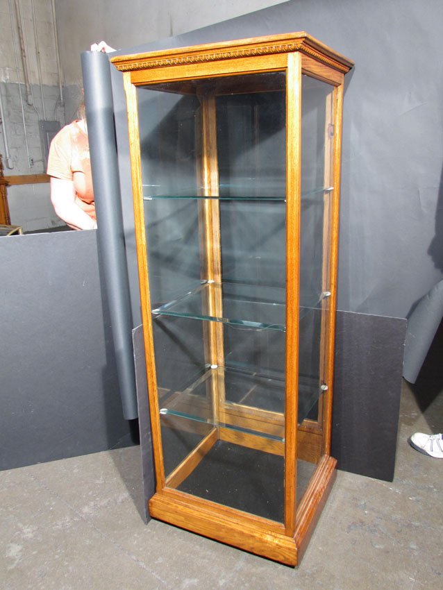 Oak Store Display Case: Oak and Glass Store Display Case with 3 beveled glass shelves. Very good condition. 21 1/2 X 60 X 20 inches.
