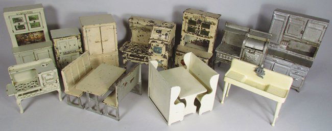 Cast Iron Doll House Kitchen Furniture: Cast Iron Doll House Kitchen Furniture. 11 total pieces includes 2 tables with bench seats. Farm house sink, Eagle stove and both tables marked Arcade. Fair to excellent condition.