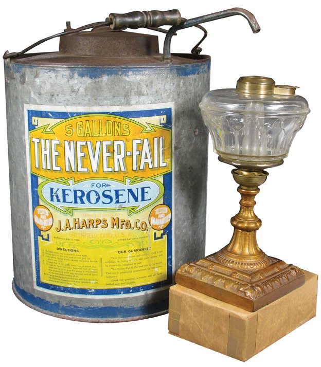 Never-Fail Kerosene 5 Gallon Galvanized Dispenser: The Never-Fail Kerosene 5 Gallon Galvanized Dispensing Tin. J.A. Harps Mfg. Co. Greenfield, Ohio. Comes with oil lamp for display. Some fading to label otherwise good condition. 13 1/2 inches tall