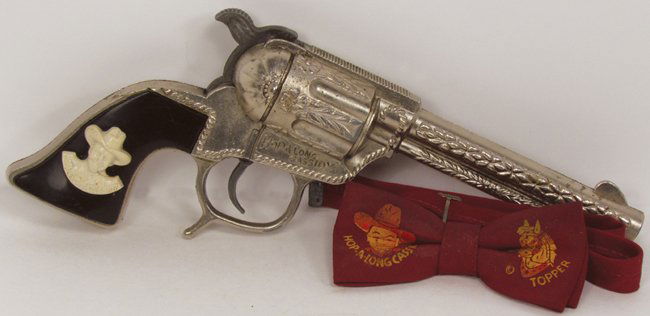 Hopalong Cassidy Cap Gun and Child's Bow Tie: Hopalong Cassidy Cap Gun and child's bow tie. Bow tie has staining, otherwise good overall condition.