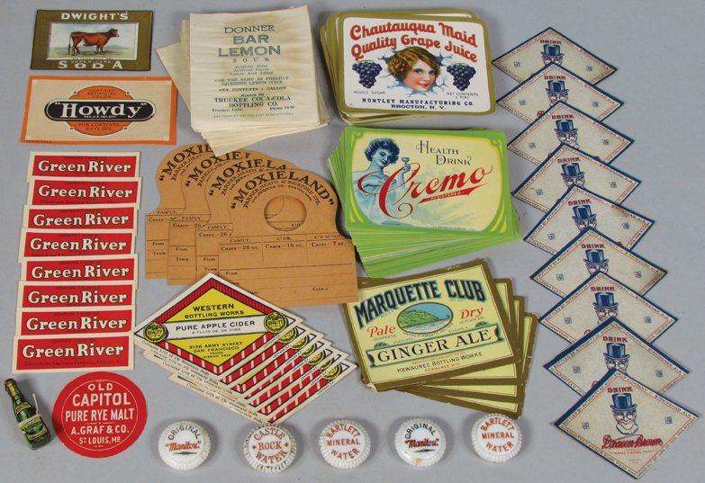 Quantity of Vintage Beverage Paper Labels: Quantity of Vintage Beverage Paper Labels. Approximately 480 total labels. 19 different varieties include Cremo and Chatauqua Maid. (5) Porcelain bottle caps for mineral water including Manitou, Castl