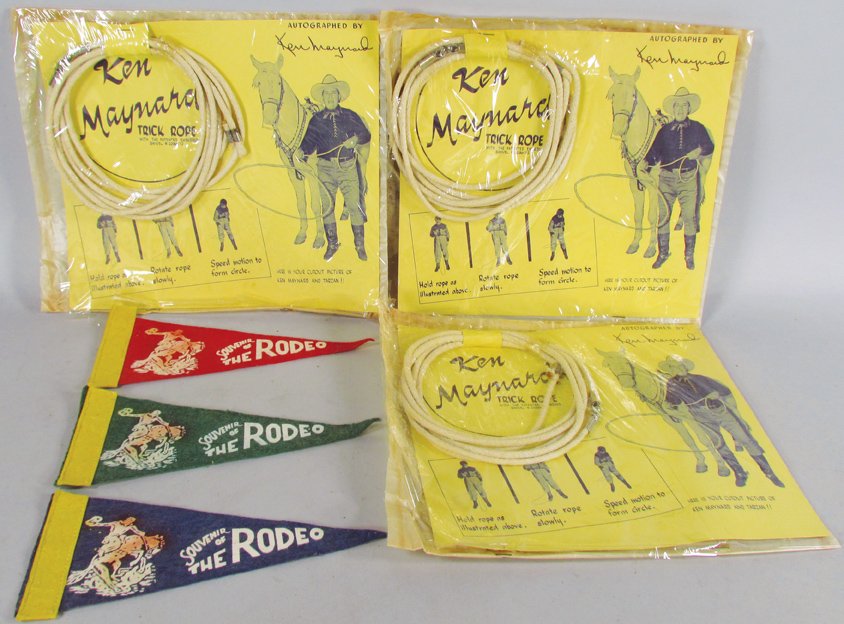 Ken Maynard Trick Ropes & Souvenir Rodeo Pennants: Ken Maynard Trick Ropes and Souvenir Rodeo Pennants. 3 Trick Ropes and 3 Pennants, slightly faded, measure 8 1/4 inches.