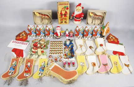 Collection of Vintage Christmas Items: Collection of Vintage Christmas Items. Die cut paper and cardboard decorations. Iron Reindeer. Celluloid Santas, Balloon Santa in original box, Germany candy container, stocking candy bags, santa ligh