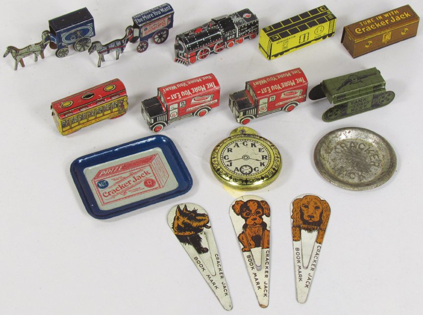 Collection of Cracker Jack Premiums: Collection of Cracker Jack Premiums. Tray, embossed plate, clock, (3) book marks, (2) Angelus marshmallow delivery trucks, Tank Corp 57, Trolley Car, Locomotive engine and refrigerator car, (2) horse