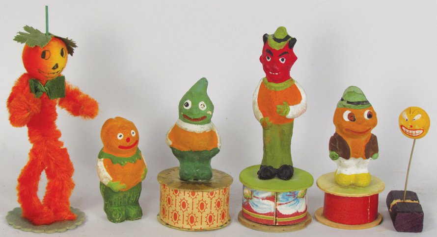 Six Vintage Halloween Items: Six Vintage Halloween Items. (3) German Molded Paper candy containers. (2) German Molded Paper figural pins. Pipe cleaner Pumpkin Man. Overall excellent condition. Largest candy container measures 4 1
