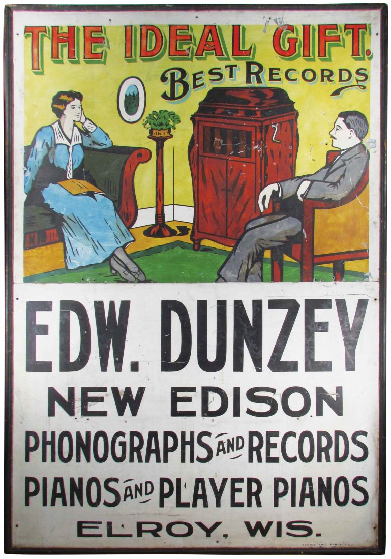 Edw. Dunzey Edison Phonograph Tin Sign: Edw. Dunzey Edison Phonograph Tin Sign. "The Ideal Gift". Phonographs, records, pianos and player pianos. Elroy, WI. Minor scuffs and scratches otherwise very good condition. 49 1/4 X 72 3/4 inches.