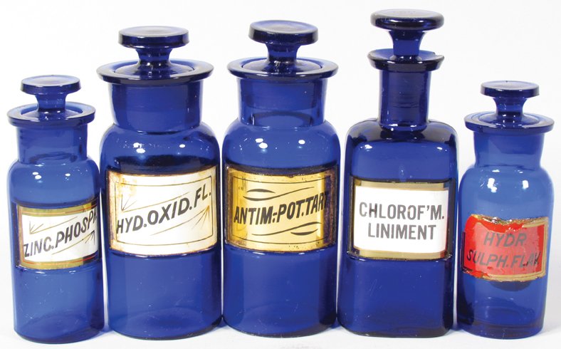 Five Label Under Glass Apothecary Jars: Collection of Five Label Under Glass Cobalt Blue Apothecary Bottles. Hydra Sulph Flak label chipped around edges otherwise overall very good condition. Tallest bottle measures 5 1/2 inches tall.
