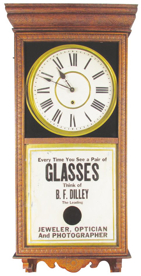 B. F. Dilley Advertising Clock: B. F. Dilley Advertising Clock. Jeweler, Optician and Photographer. Reverse painted glass front, tin face and wood case. Some minor touch up around edges otherwise good condition, comes with pendulum