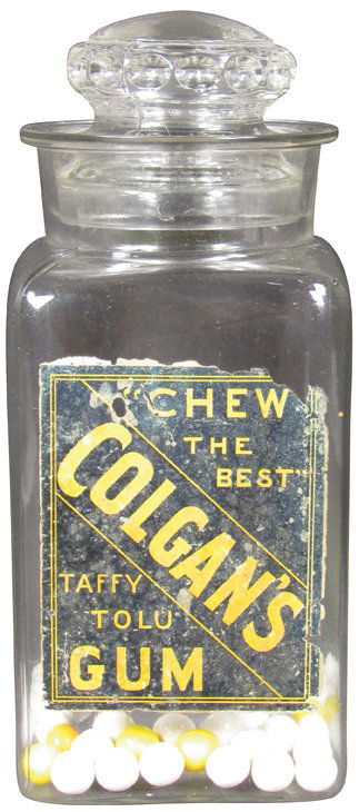 Colgan's Taffy Tolu Gum Store Display Jar: Colgan's Taffy Tolu Gum Store Display Jar with original paper label. Chips on lid and exterior lip of jar. 4 1/2 X 10 1/2 X 4 1/2 inches.