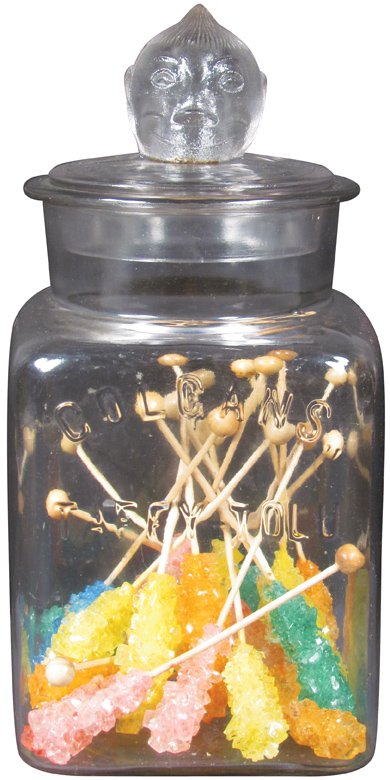 Colgan's Taffy Tolu Gum Store Display Jar: Colgan's Taffy Tolu Gum Store Display Jar. Embossed jar with figural lid. Tiny chips on interior lip otherwise very good condition. 5 X 11 X 5 inches.