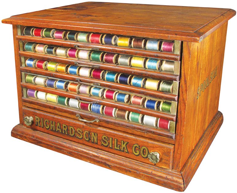 Spool Cabinet: Richardson's Silk Co. Oak Spool Cabinet. Original decals both front and sides. 5 glass front drawers and a wood bottom drawer. Some staining on the top, otherwise good condition. 25 X 15 X 16 1/2 Inch