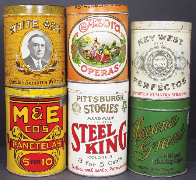 Collection of Six Cigar Tins: Collection of Six Cigar Tins. Key West Perfectos, White Ash, Havan Grant and Azora Operas 25 count tins. M & E Co's Panetelas and Steel King Colones 50 count tins. Overall excellent to good condition.