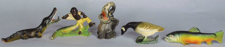 Five Original Cast Iron Bottle Openers: Collection of Five Original Cast Iron Bottle Openers. Spotted Trout, Elephant, Alligator, Canada Goose and Black Americana with alligator. Overall very good condition.