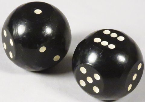 Pair of Early "JoJo" Dice: Pair of Early "JoJo" Dice. Bearings in dice to prevent cheating. Excellent condition. 7/8 inch.