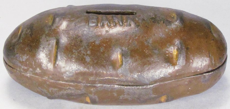 "Pingree Potato" Cast Iron Still Bank: Pingree Potato Cast Iron Still Bank. Mary A Martin, designer. Most original paint intact. 5 inches long.