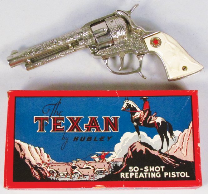 Hubley Texan 50-Shot Repeater Toy Cap Pistol: Hubley Texan 50-Shot Repeater Toy Cap Pistol # 285 in original box. White grip. Gun excellent, box has very slight wear with one small flap missing.