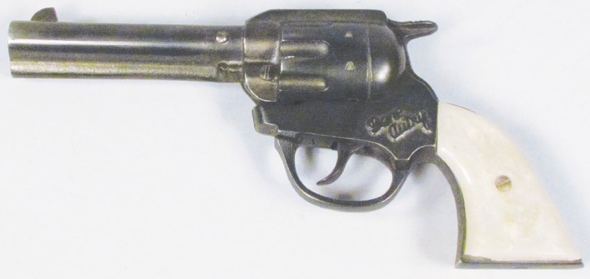 Gene Autry Toy Cap Pistol: Gene Autry Toy Cap Pistol by Kenton Toys. Small chip on bottom of grip, barrel will not stay locked, needs adjustment.