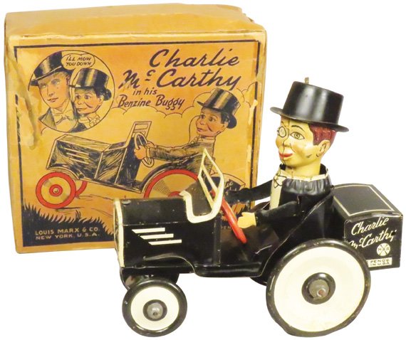 Louis Marx Charlie Mc Carthy Tin Wind Up Toy: Louis Marx Charlie Mc Carthy Tin Wind Up Toy with original box. Rub on hood and repair on left wheel otherwise good condition, box shows wear. Toy measures 7 1/4 inches long.