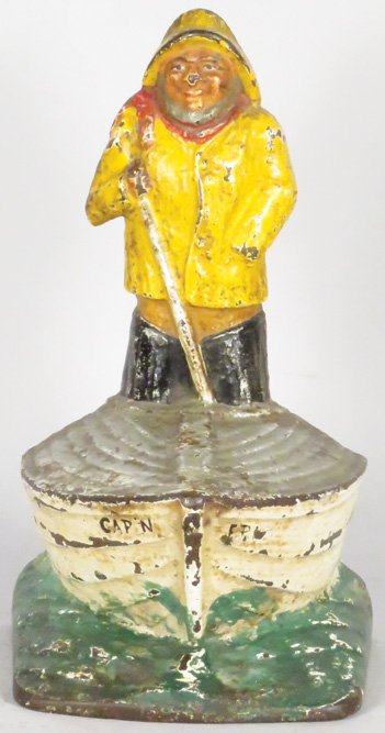 Cast Iron Fisherman in Boat Doorstop (1 of 2)