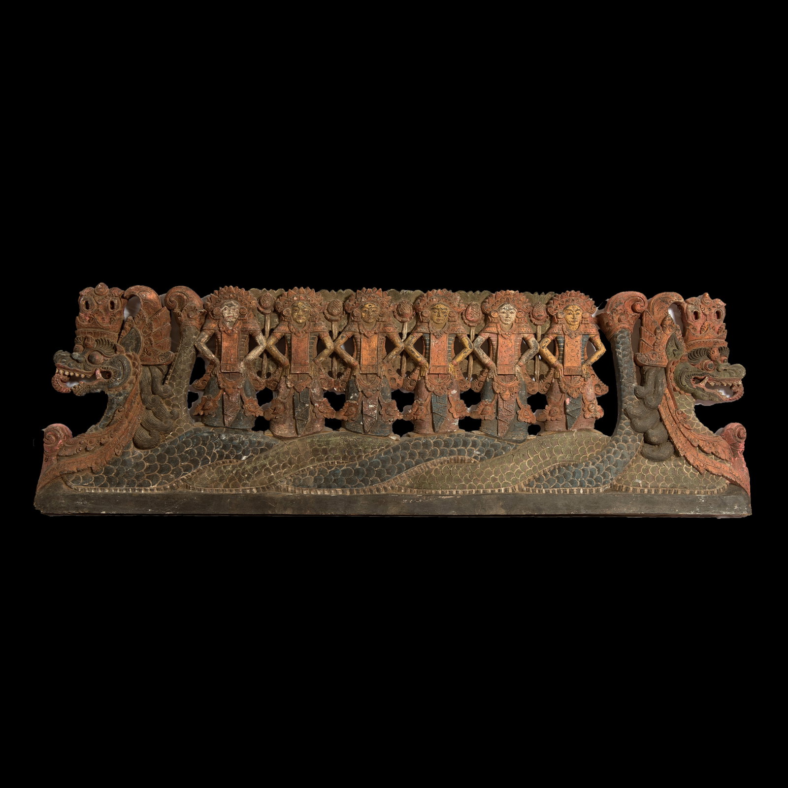 Dragon carving from Bali: A recent, yet absolutely stunning rendition of Balinese carving. 2 dragons facing apart with women standing on them. 45 x 14.25 inches. Probably mid to late 20th century. If you have additional questi