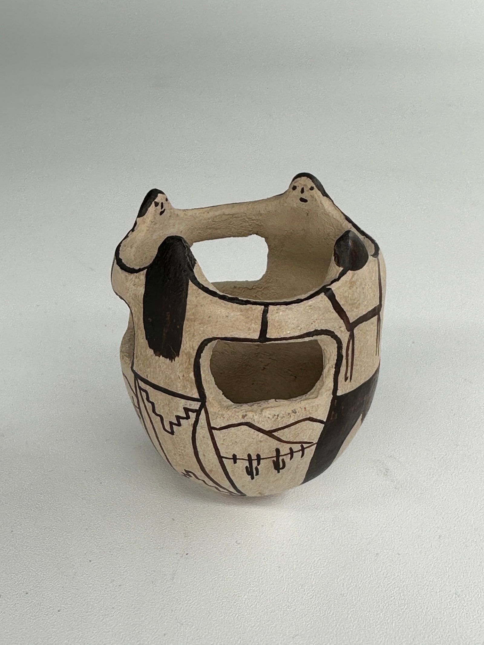 Tohano O'odham friendship vase: This beautifully crafted piece was made by a member of the Tohono O'odham Nation, a federally recognized tribe whose ancestral lands span the Sonoran Desert of southern Arizona and northern Mexico. Th