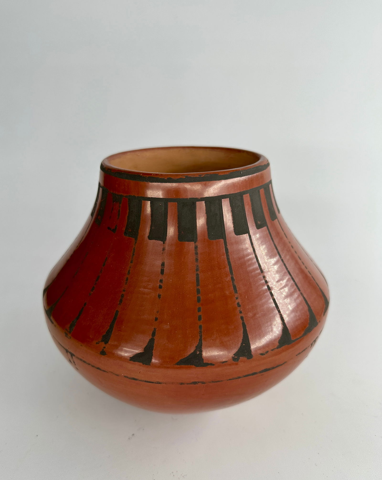 Blue Corn red bowl with black feathers (1 of 5)