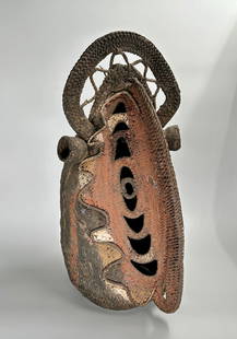 Huge beautifully painted woven yam mask: Mid-20th century Papua New Guinea Yam Mask. Yes, it is a mask for a vegetables. Also an important cultural symbol. A striking hand-woven vegetal fiber mask of tall form, painted in vivid hues of russe
