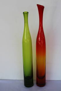 Pair of Vases by Joel Myers, Model No. 6427 for Blenko: Pair of hand blown colored glass vases, model no. 6427, 1960s by Joel Myers. Manufactured by Blenko. The tallest vase is 23.5" high and 2.75" diameter. The smaller vase is 21.75" high, 2.75" diameter.