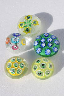 Five Italian Murano Flower Glass Paperweights: Five Italian Murano glass paperweights. They range from 2" - 2.5" high and 3" - 3.75" diameter.
